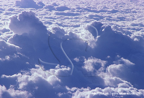 Clouds from the air: backlit aerial of convective cloud development