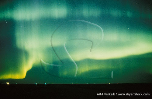 Eerie green curtains of striated Aurora Borealis
