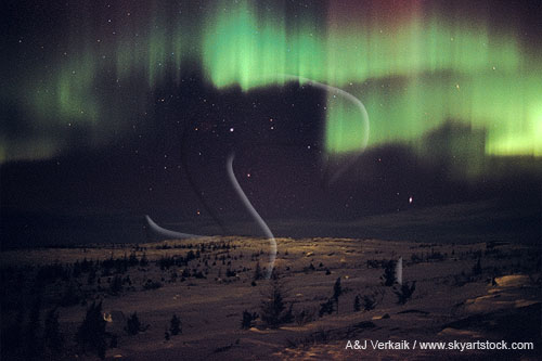 Curtains of northern lights spread mystery across an arctic landscape