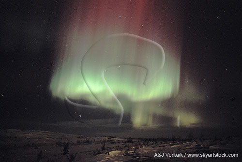Aurora Borealis: swirling red and green overlapping curtains
