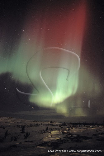 A sweep of red and green drapery in an Aurora Borealis display
