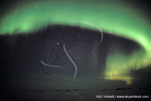 Awe-inspiring arc of northern lights (Aurora Borealis) in the arctic