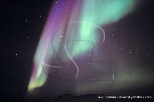 Bright swords of purple and green northern lights (Aurora Borealis)