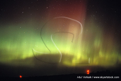 Folded curtains of green and red northern lights (Aurora Borealis)