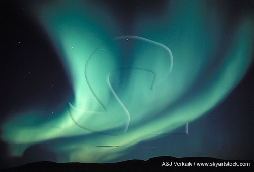 Blue-green wavy bands of northern lights (Aurora Borealis)