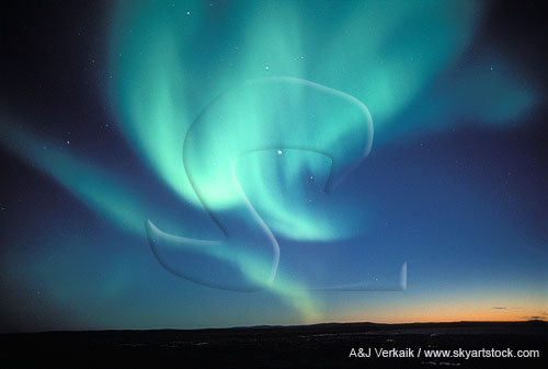 Aurora Borealis look like angels swooping down over arctic hills