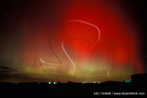 The wow factor: bright red northern lights over farm lights