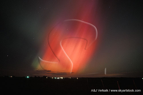 Flaming red northern lights (Aurora Borealis) in the night sky