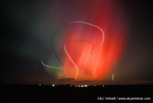 War of the gods, with spears of red Aurora Borealis in the night sky