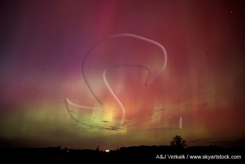 Patches and streaks of red, green and purple northern lights