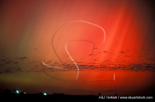 Fiery red curtains of Aurora Borealis set the night on fire