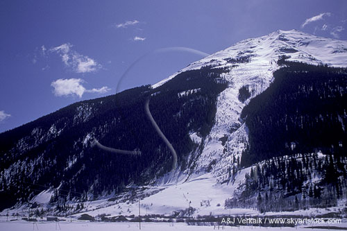 Snow slide swath from a mountainside avalanche