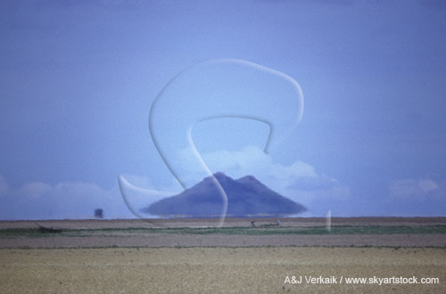 Two buttes appear to float above the horizon in this inferior mirage