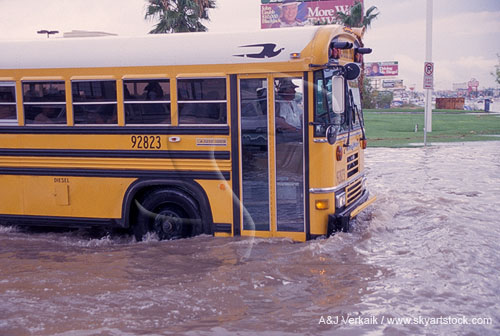 A school bus caught in street flooding after a thunderstorm