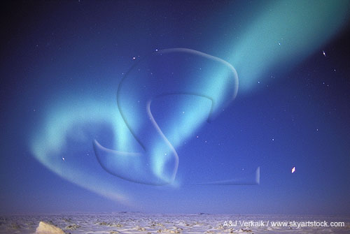 Swirling bands of northern lights (Aurora Borealis) in arctic twilight