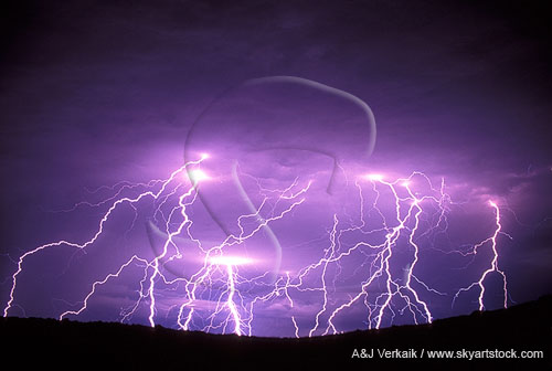 Many finely detailed lightning strikes dance in an eerie glow