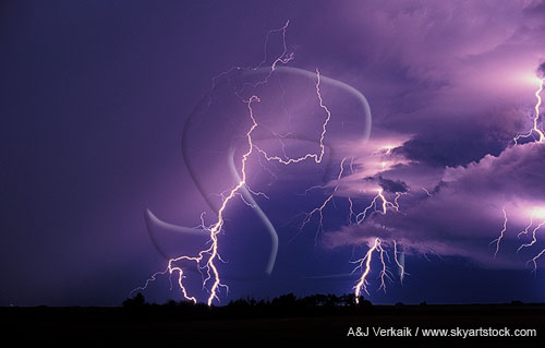 Jagged cloud-to-ground lightning bolts with glowing clouds
