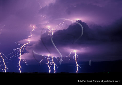 Brilliant cloud-to-ground lightning pierces low clouds
