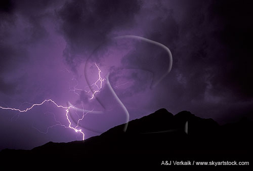 A single knotted lightning bolt behind a silhouetted mountain