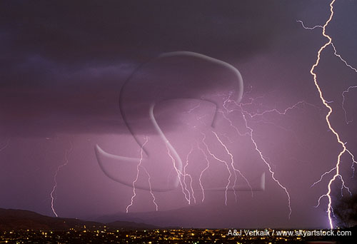 Multiple cloud-to-ground lightning strikes in the mist