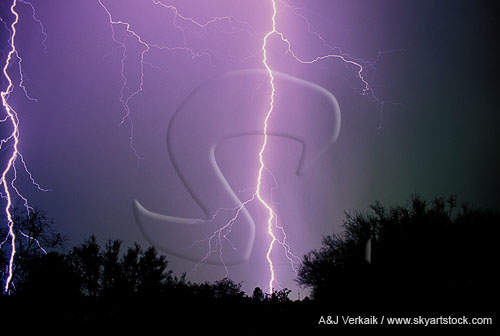 Very close cloud-to-ground lightning bolts strike fear
