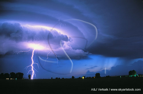 Brilliant lightning with an illuminated laminar wall cloud