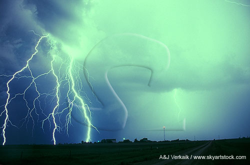 Hairy lightning strikes alongside a highly electric rain-shrouded flash