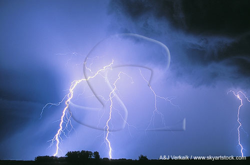 Bright lightning bolts flash in a churning sky