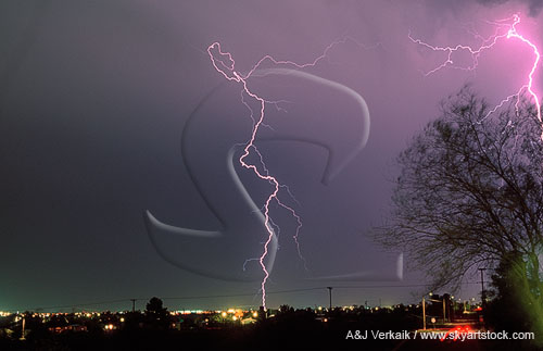 Cloud-to-ground lightning bolts in the city