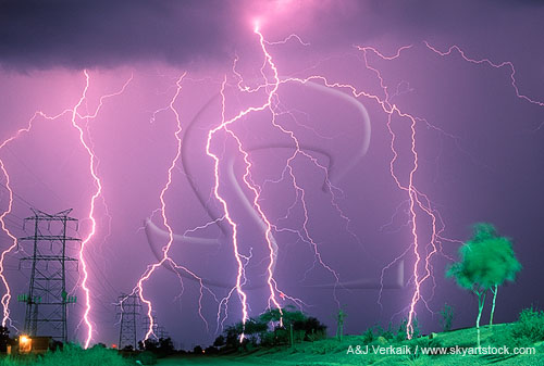 Close-up of highly electric lightning strikes in a powerline corridor