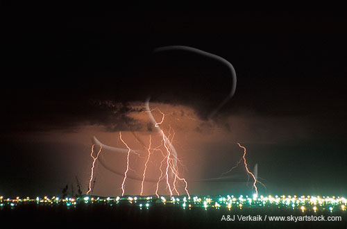 Multiple cloud-to-ground lightning strikes enlighten a city