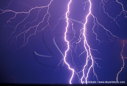 Searing lightning in a close-up of bolts with fine filaments