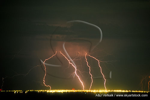 Lightning strikes over the lights of Calgary