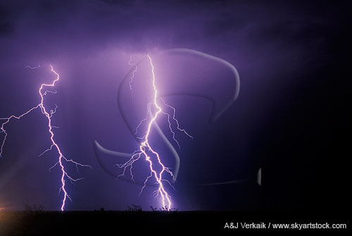 Two bright and hairy lightning bolts in a dark sky