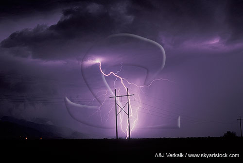 An electrical display, cloud-to-ground lightning and power lines