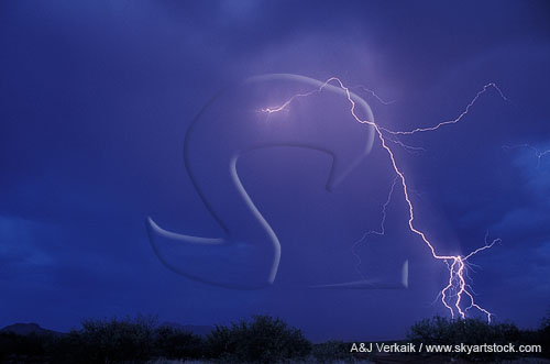 A single lightning bolt reaches out from a storm at twilight