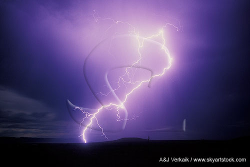 A single lightning superbolt electrifies in a twilight shower