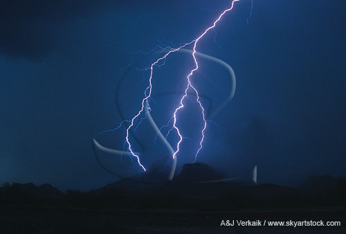 Lightning strikes a mountain in a raging twilight dust storm