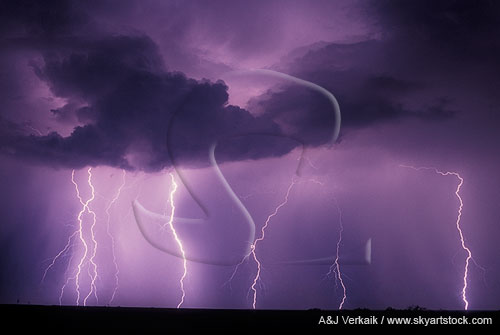 Multiple lightning strikes with ghostly clouds