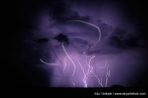 Ghostly clouds with lightning bolts in the rain
