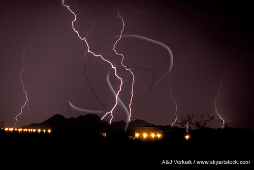 Cloud-to-ground lightning with foreground lights