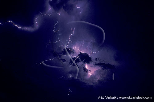 Fine fingers of intracloud lightning spark through an inky sky