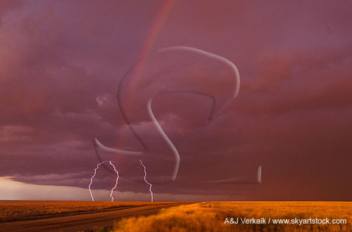 Lightning strikes with a rainbow arc in golden twilight
