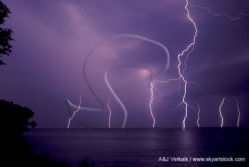 Cloud-to-ground lightning bolts over water