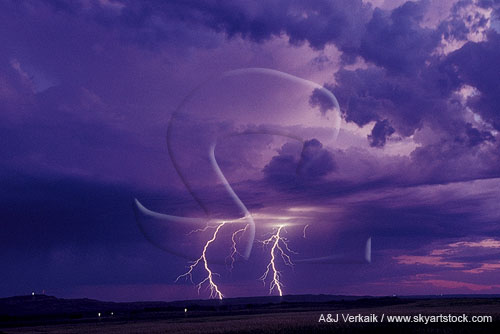 Cloud-to-ground lightning bolts in a purple sky at twilight