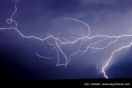 A flash of rare horizontal lightning dangles over a discharge bolt