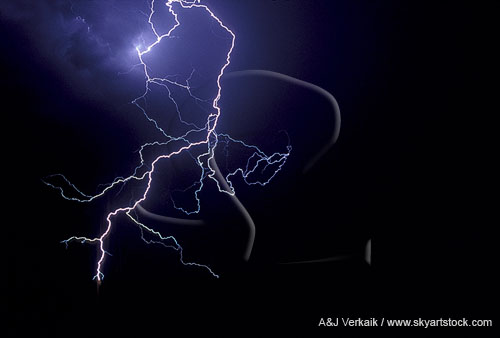 A jagged lightning discharge with multi-colored branches