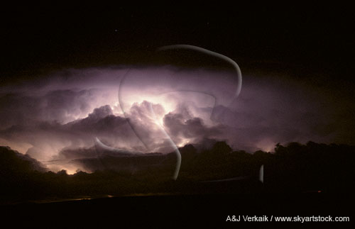 Intracloud lightning shows cloud detail in a storm’s crown