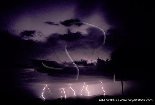 Distant bolts of lightning with cloud flashes above