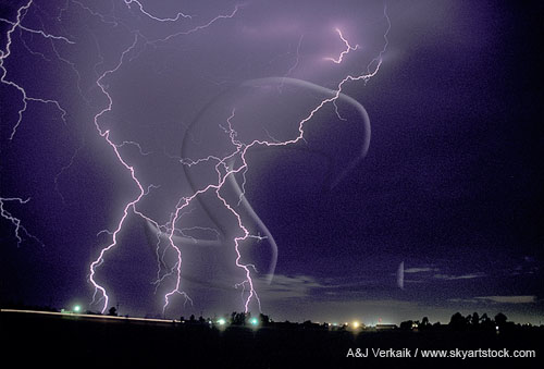 Jagged zigzag lightning discharges in a twilight sky